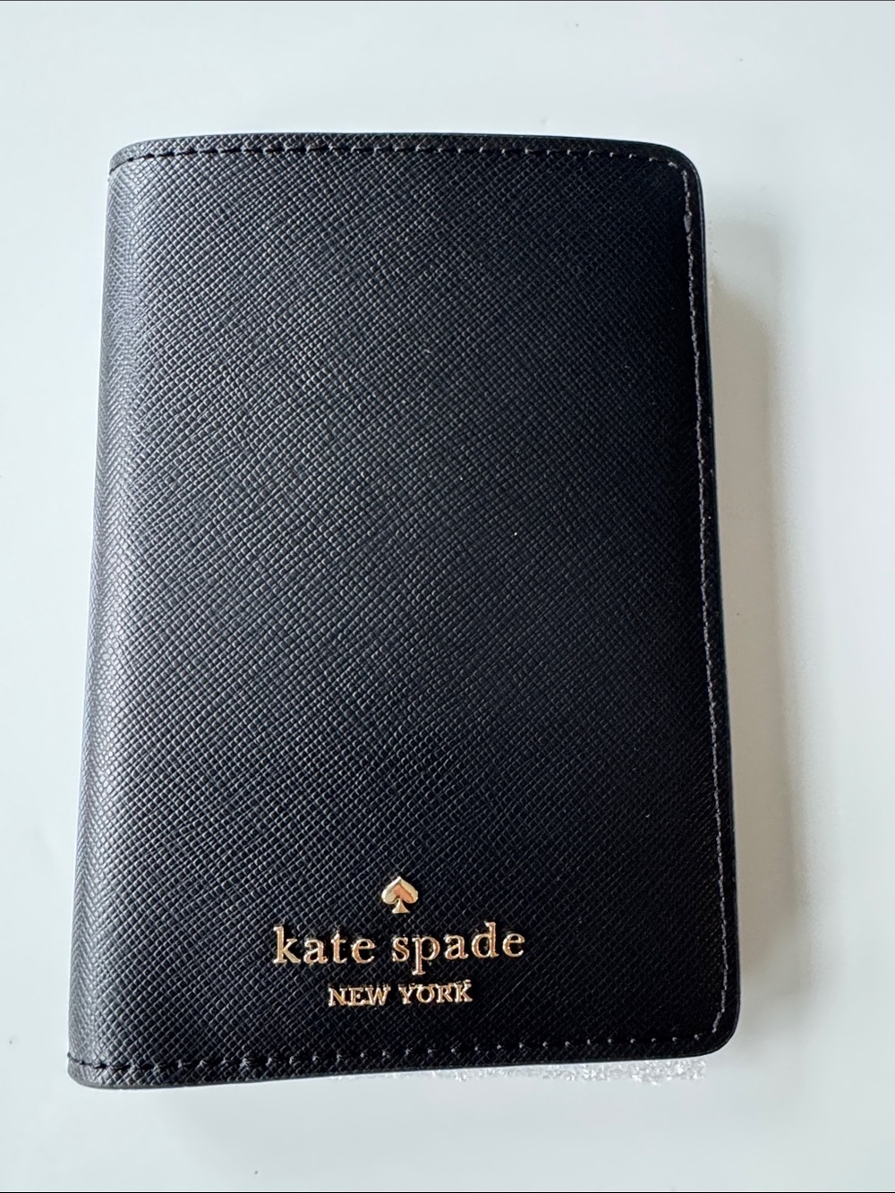 kate spade black passport cover with gold logo